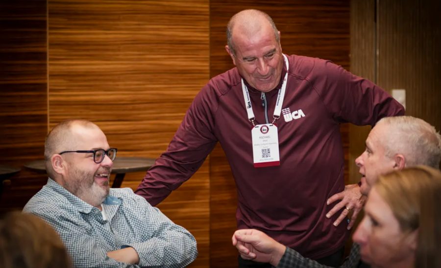 WCA staff connecting and laughing with attendees at the Foxwoods Technology Conference
